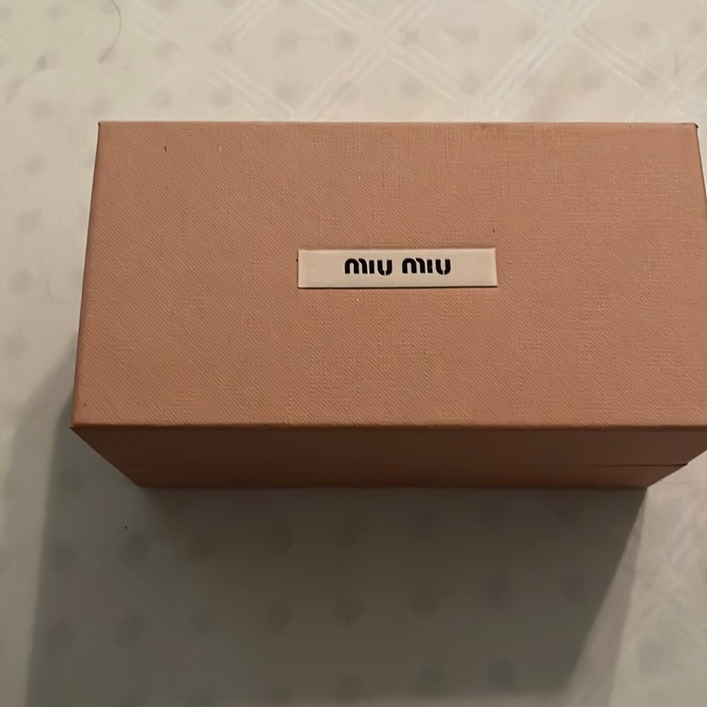 Sunglasses, has light tone of grey and black. New box, case, cleanse cloth NWOT